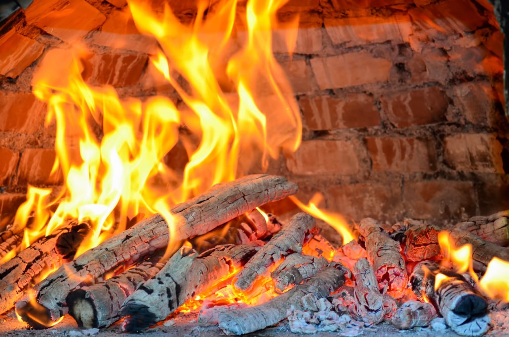 Wood-fired pizza oven heating