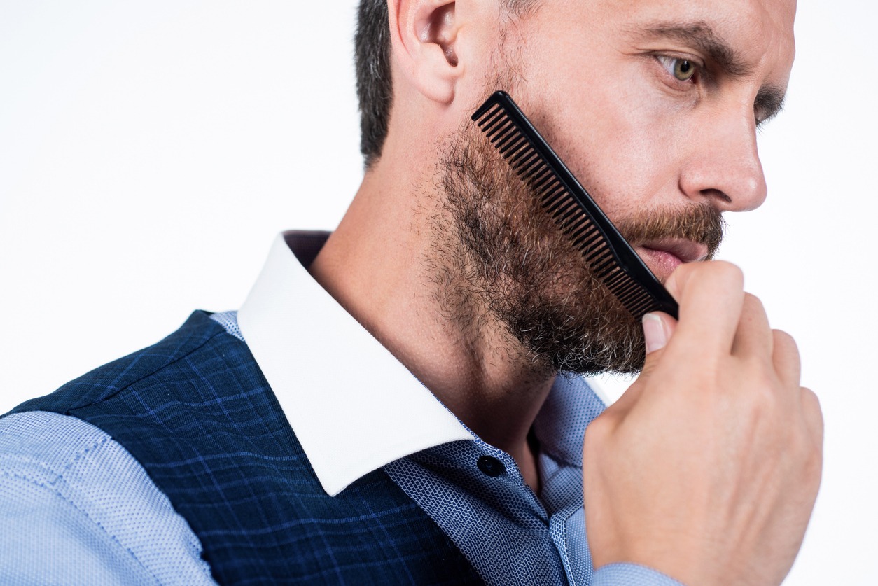 A man combing his beard