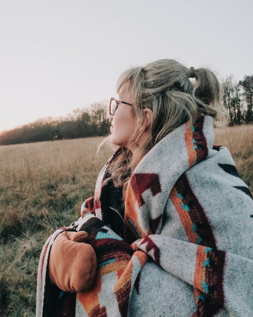 a woman covered in blanket