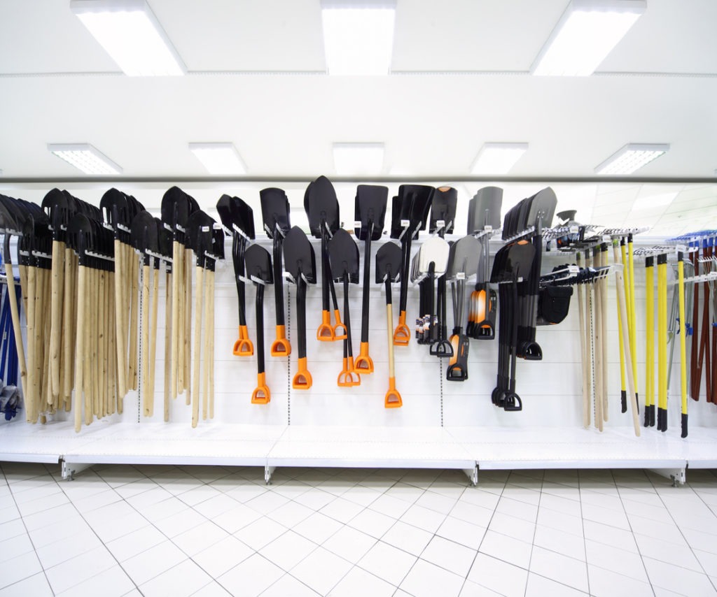 a line of different gardening tools in a supermarket