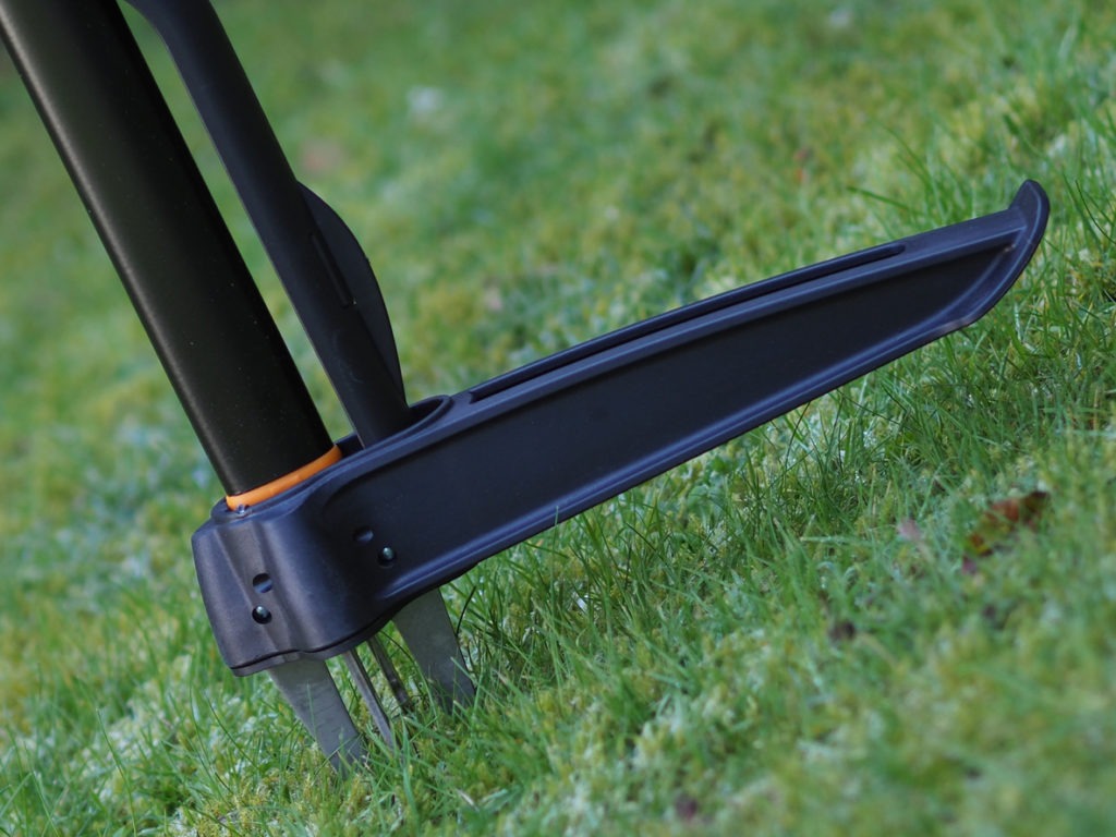 weed puller in grassy area