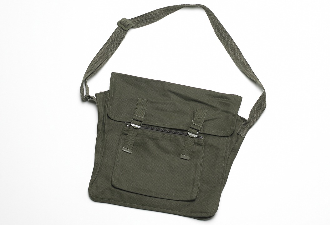 olive green messenger bag in white background