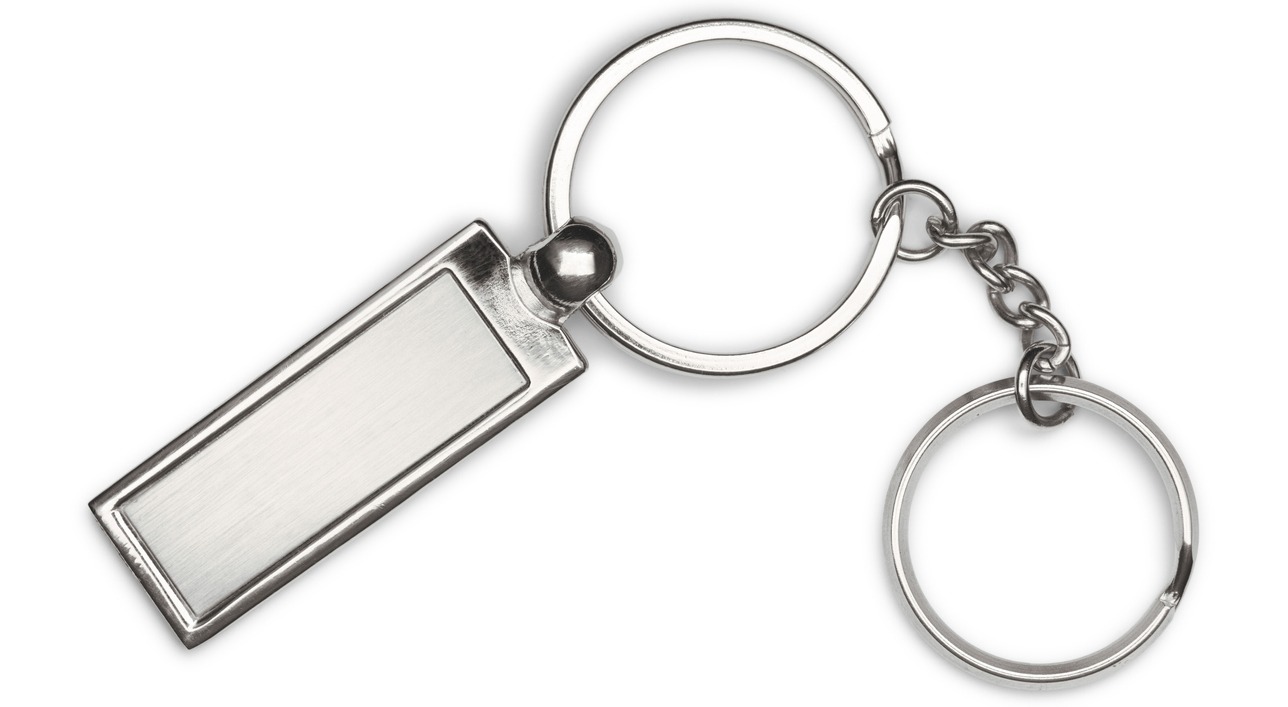 silver key chain with chain and rings in a white background
