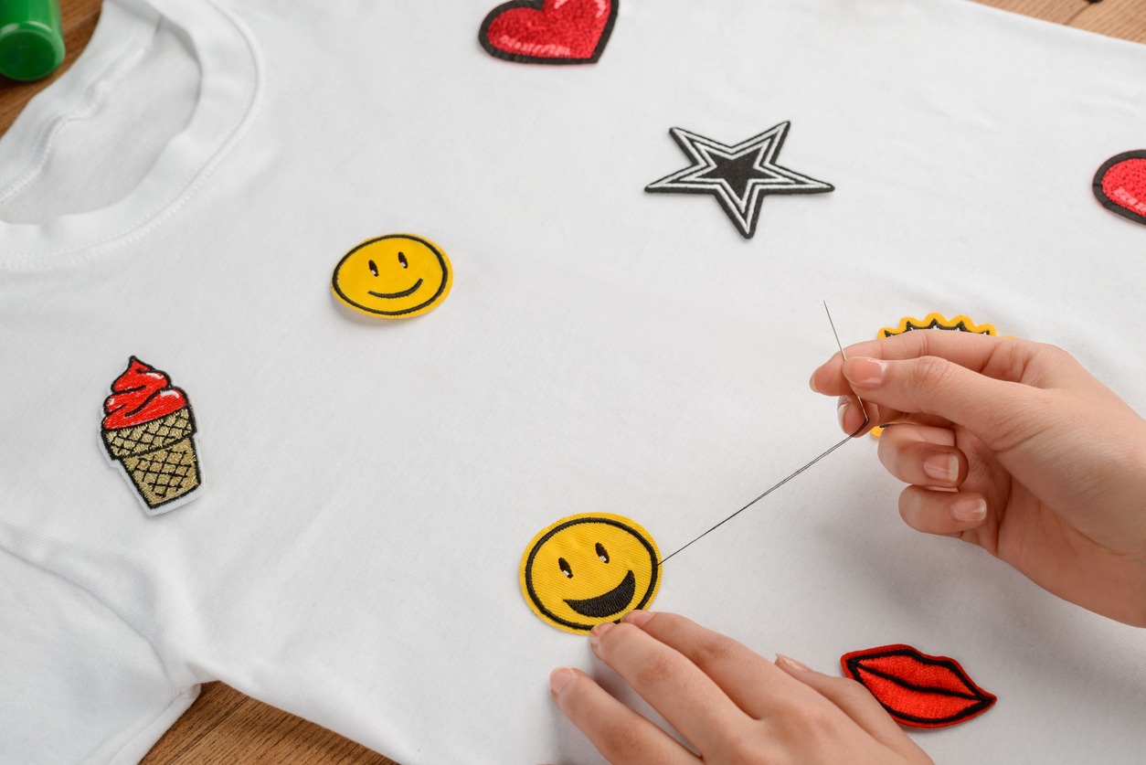 white t-shirt with sewn patches