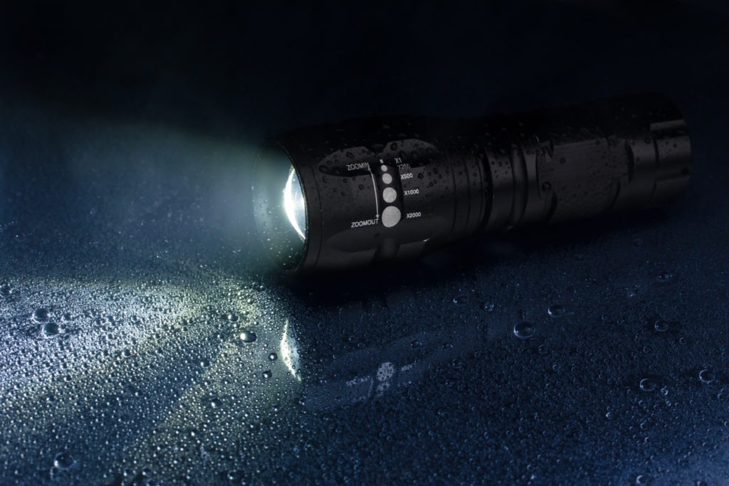 A black tactical flashlight