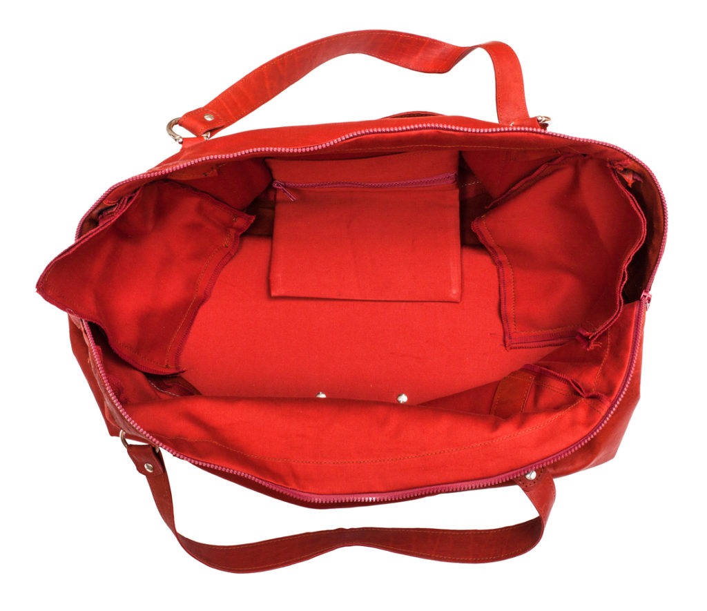 a red handbag with a small pocket inside
