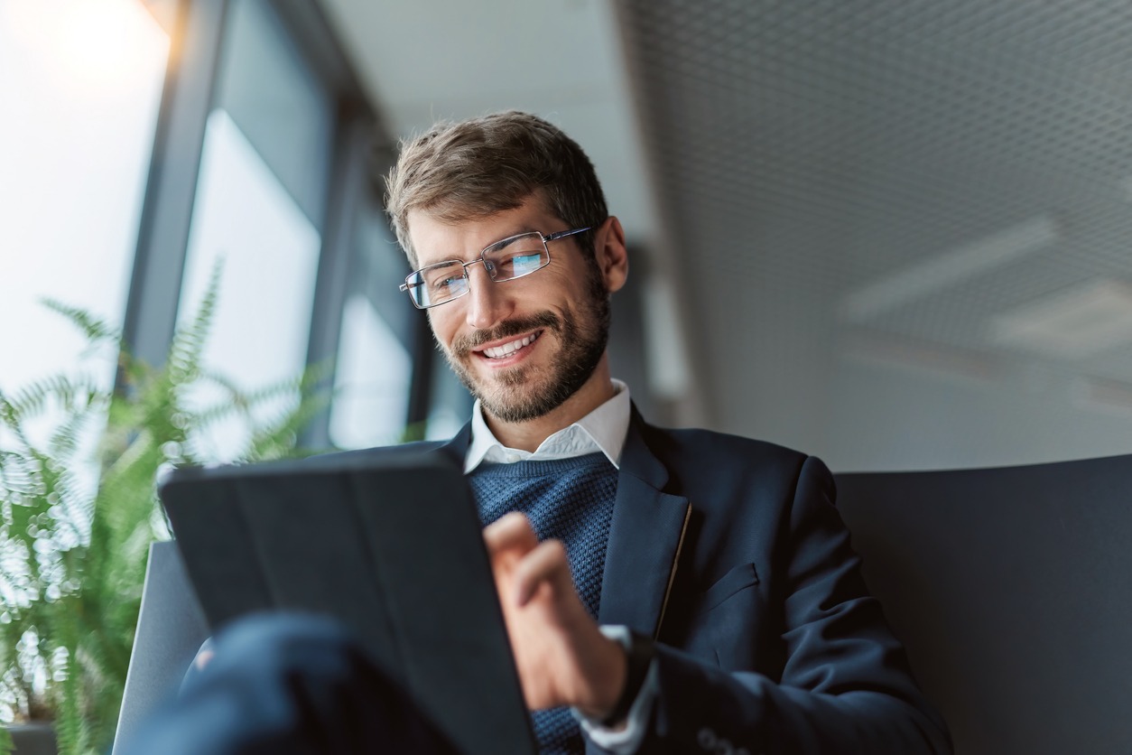 Man with e-book on tablet