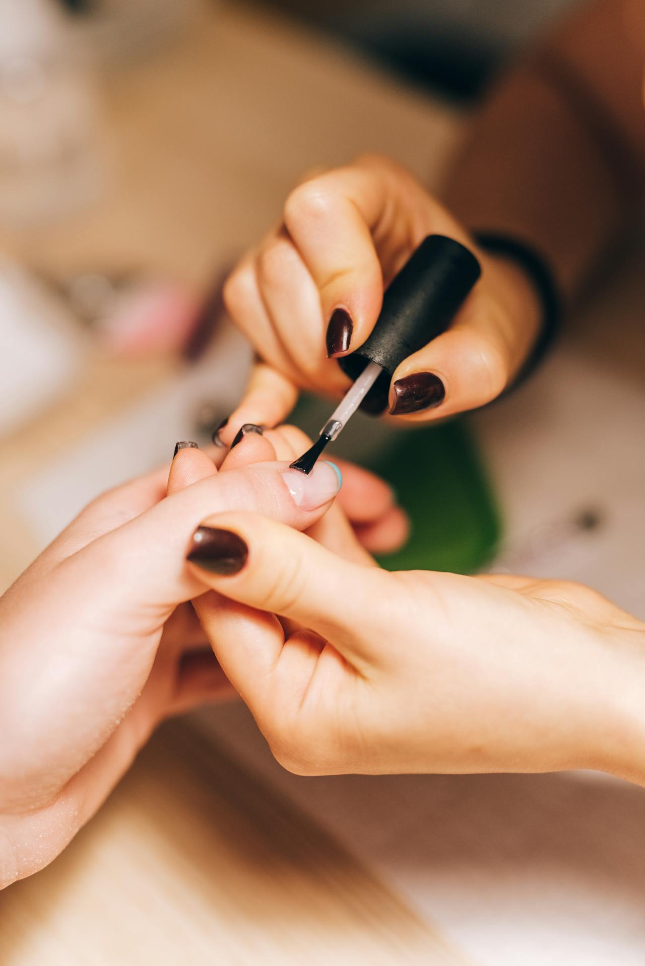 a person getting a nail polish