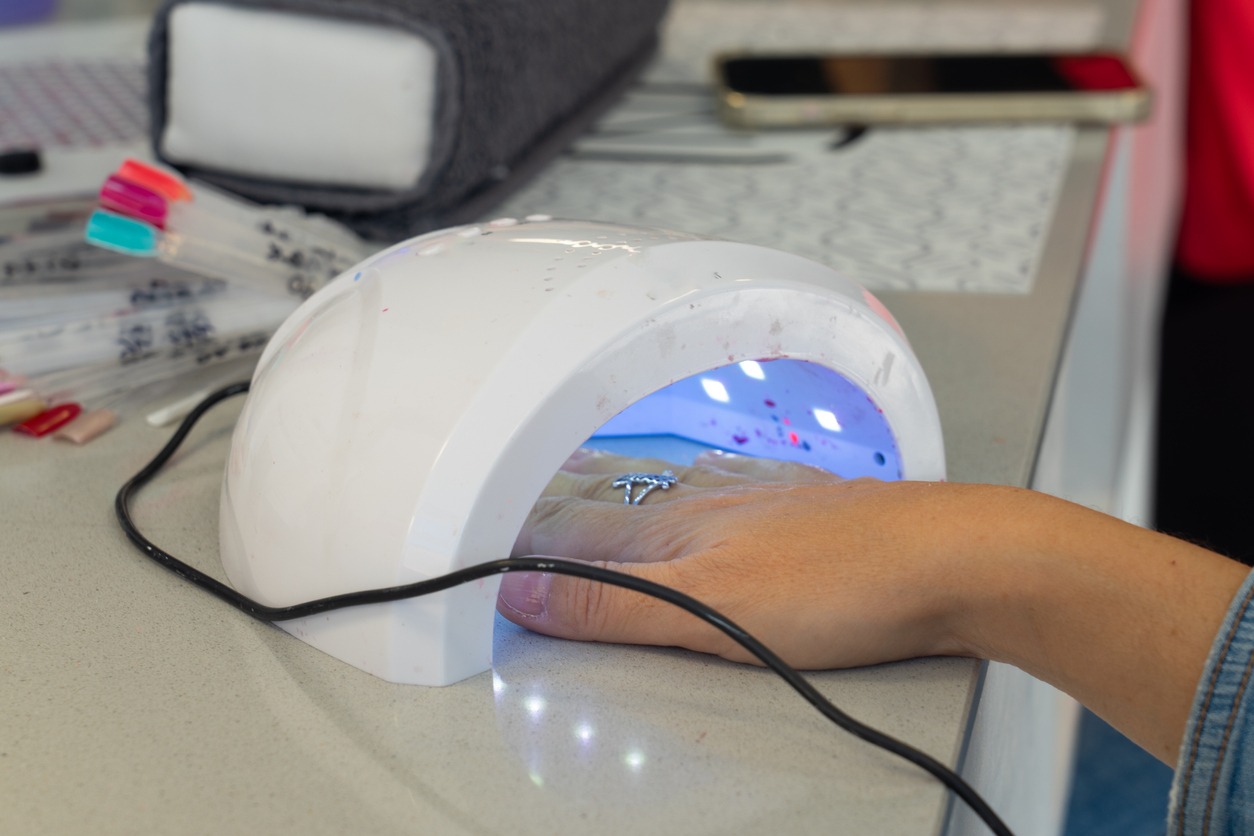 Woman drying her nails in a manicure