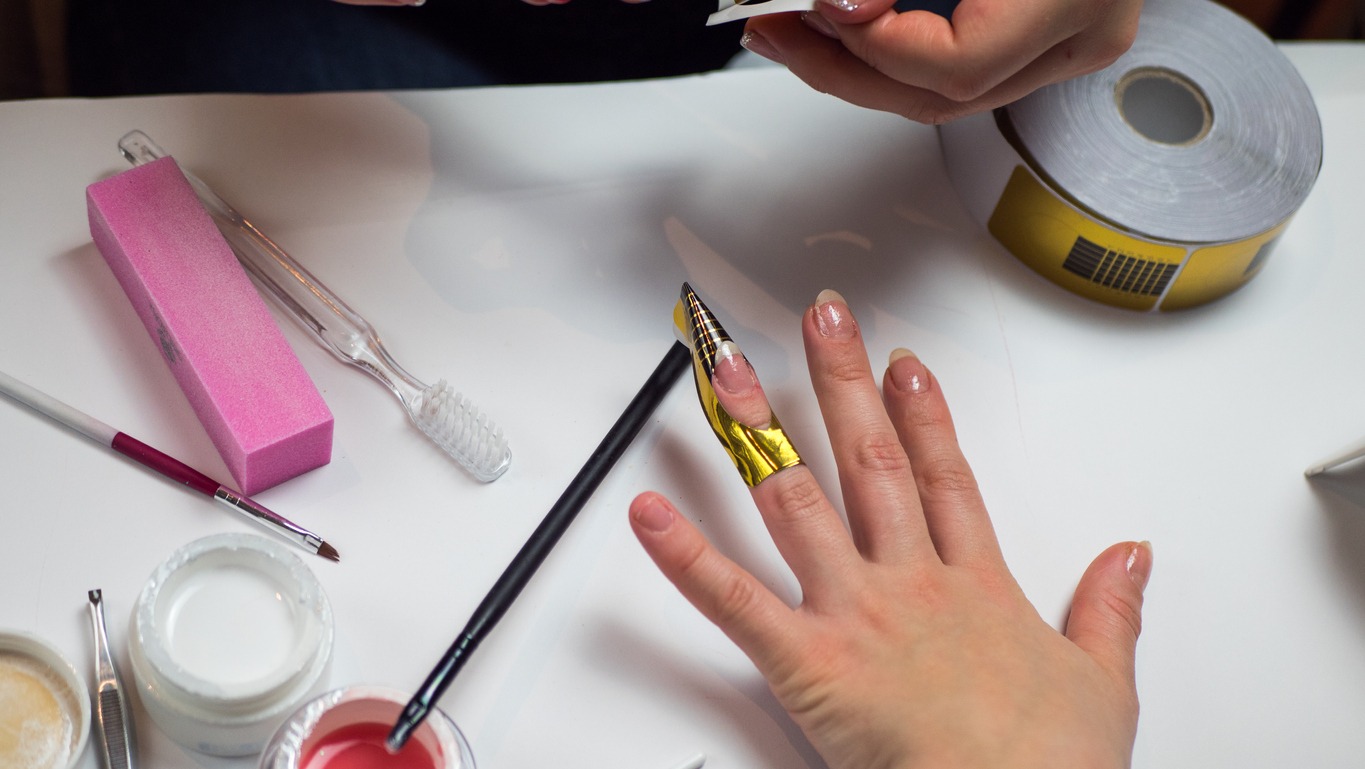 Professional manicure process in beauty salon