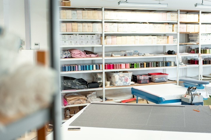 Interior of a sewing warehouse of furniture factory with equipment and materials 