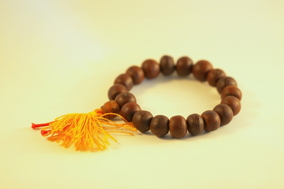 a close up of a sandalwood bracelet
