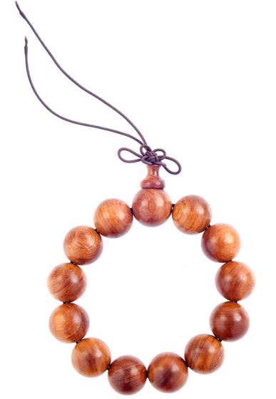 an sandalwood bracelet placed upright