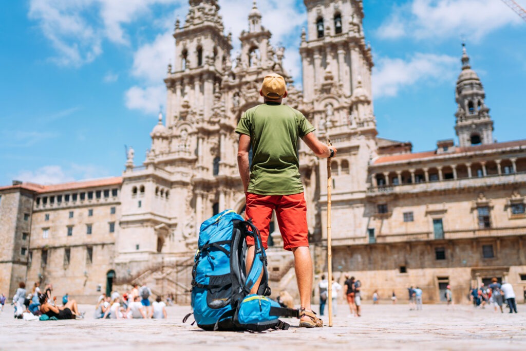 backpacker looking at historical building