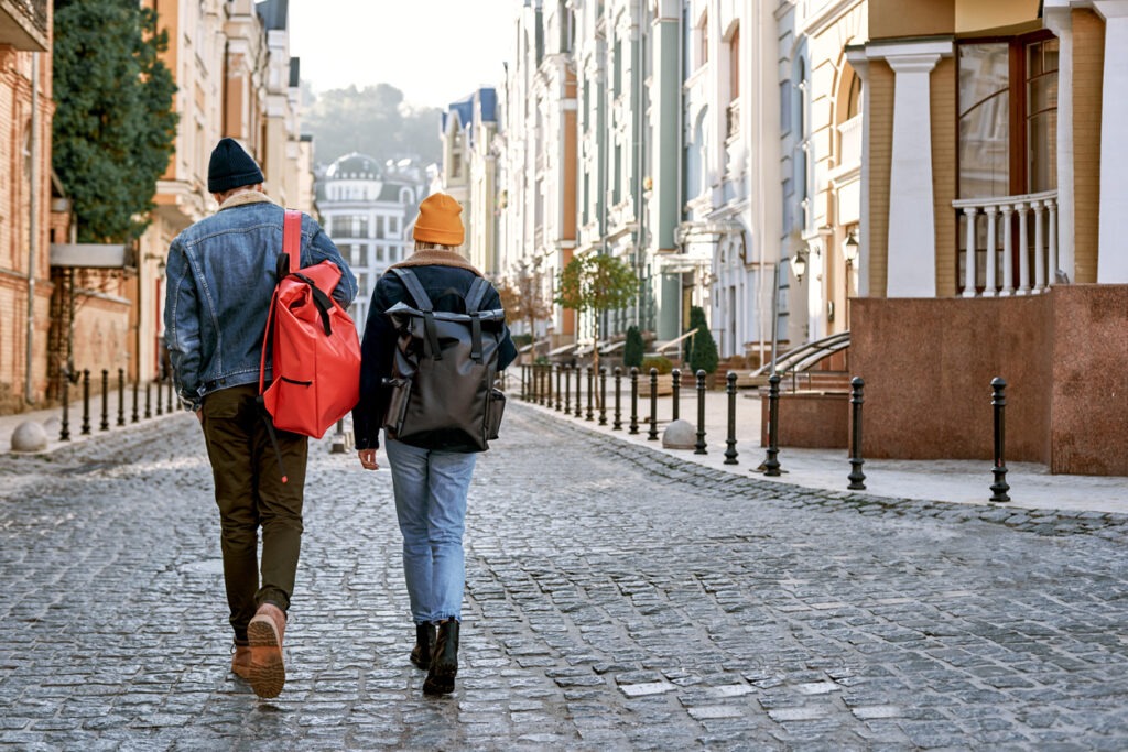 urban backpackers strolling on the street