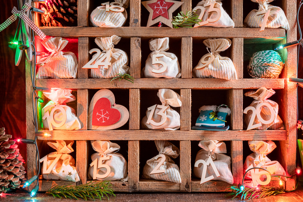 Unique Advent Calendar for Christmas in an old wooden box on dark background