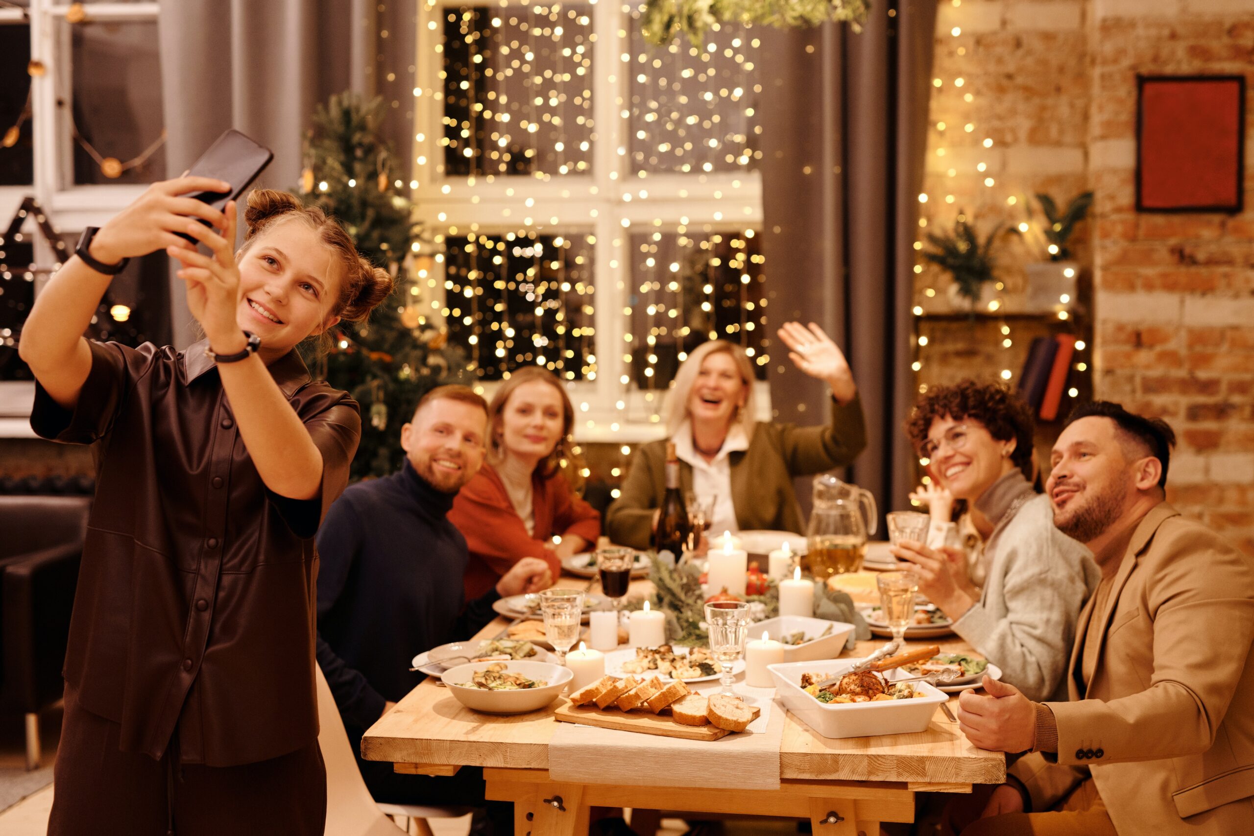 a group of women having dinner and smiling
