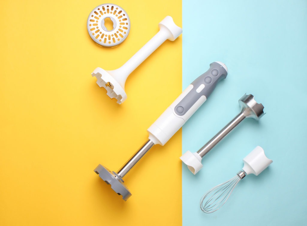 An immersion blender with different attachments