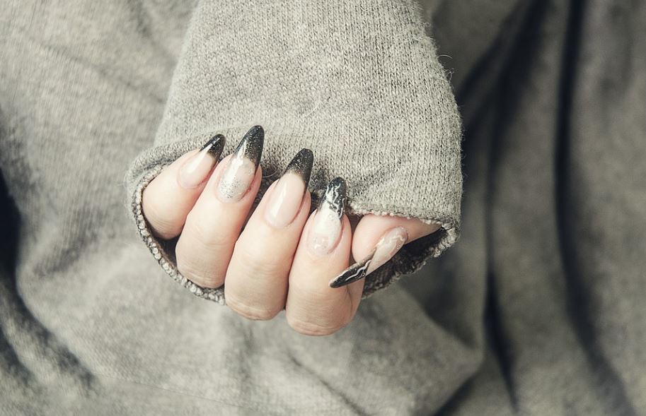 nails extended via acrylic manicure