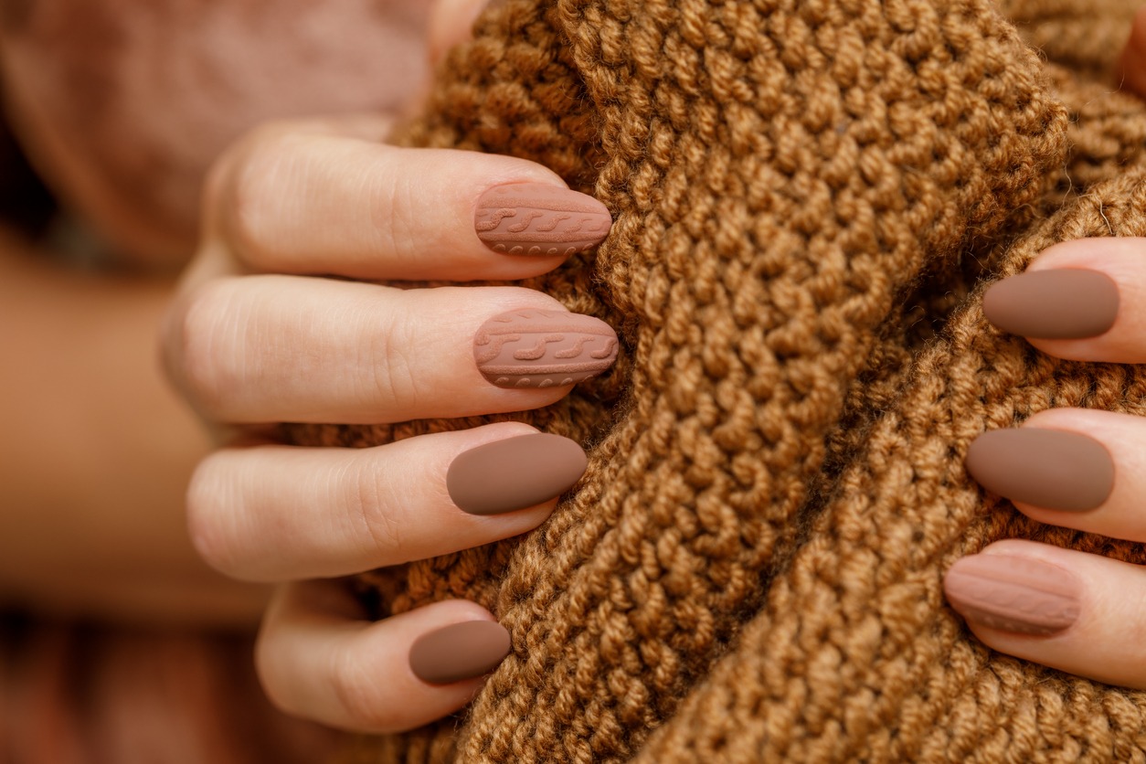 nails painted with matte nail polish