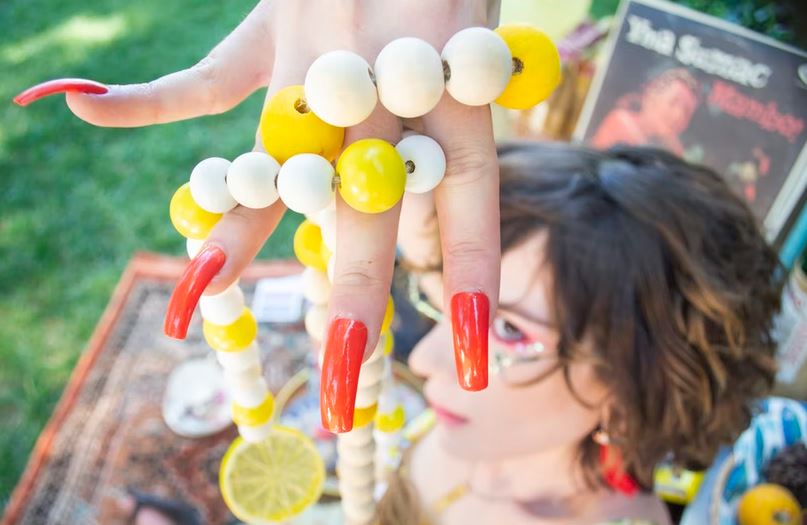 woman with acrylic nail polish