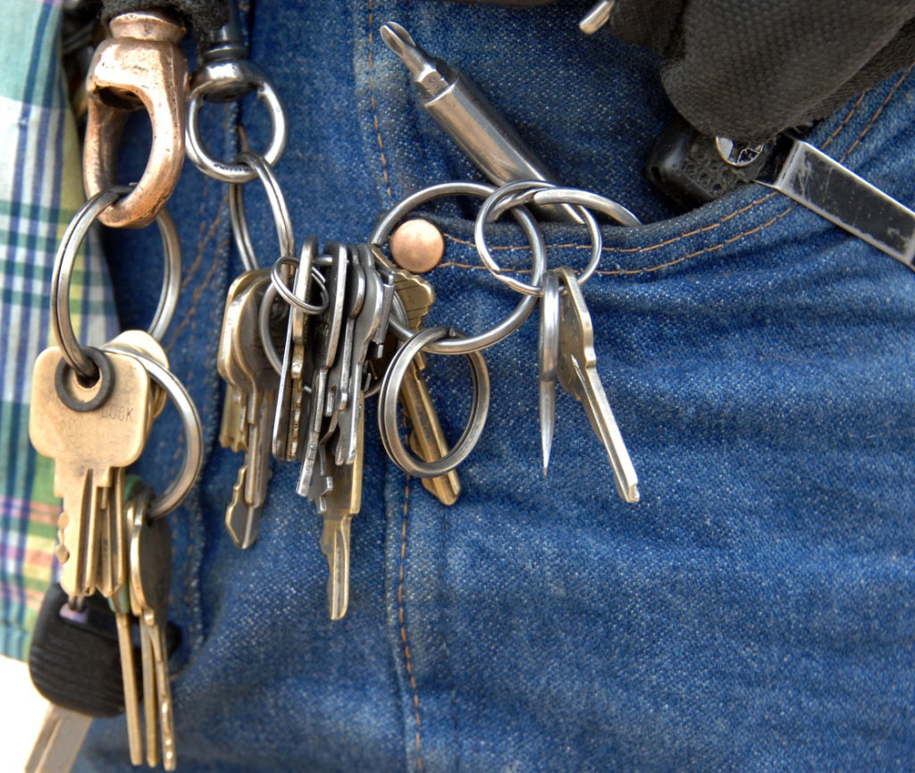 keychain with multiple keys hang on janitor’s waist