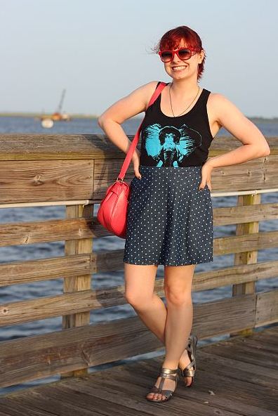 A woman wearing a graphic black tank top