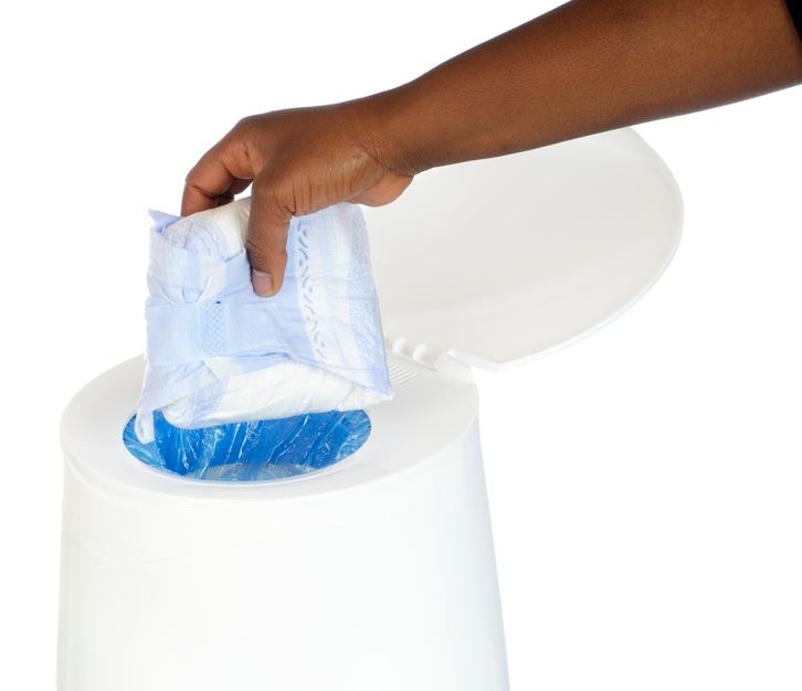 man disposing a diaper in white background