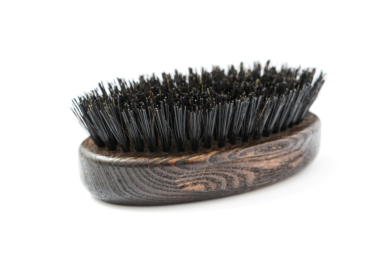 a short-bristled beard brush without a handle
