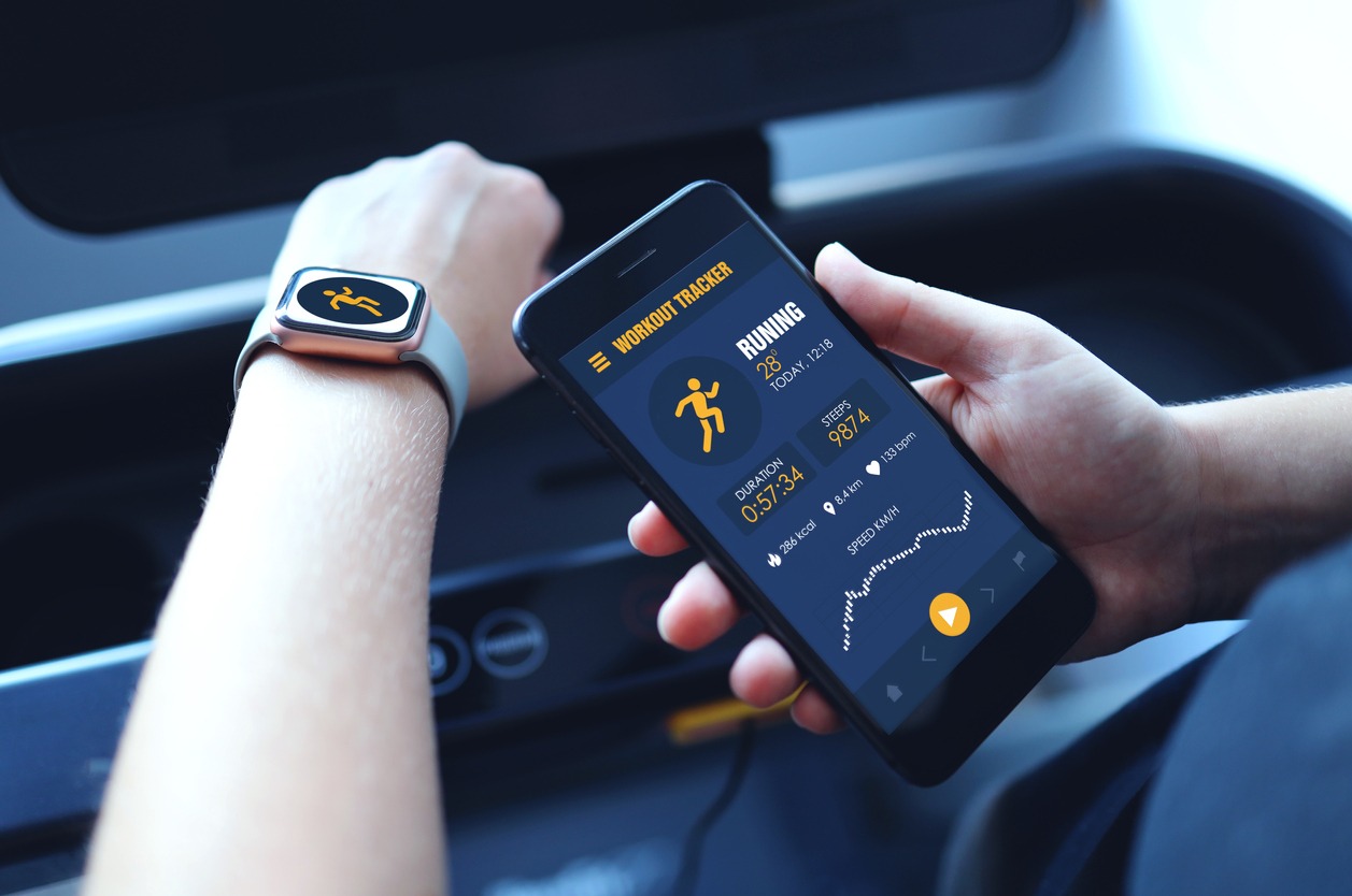 A fitness tracker with its mobile application.