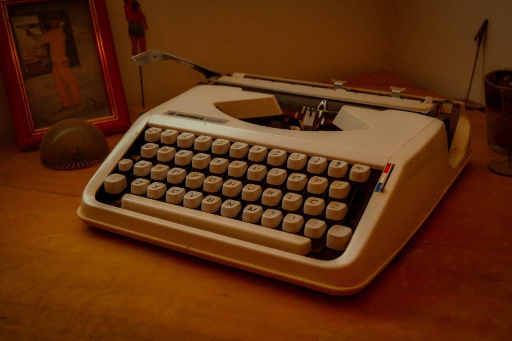 white typewriter on desk