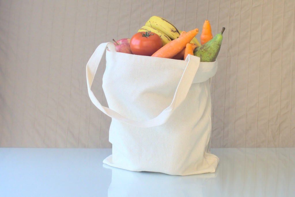 Reusable textile Tote bag full of vegetables and fruits