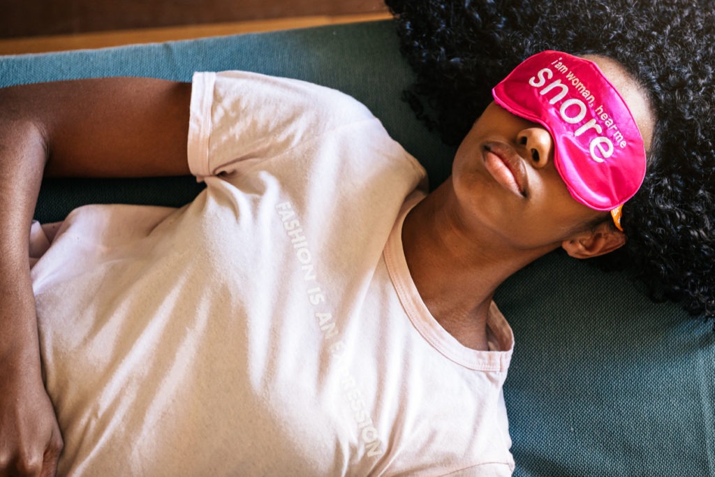 Young woman sleeping with eye mask