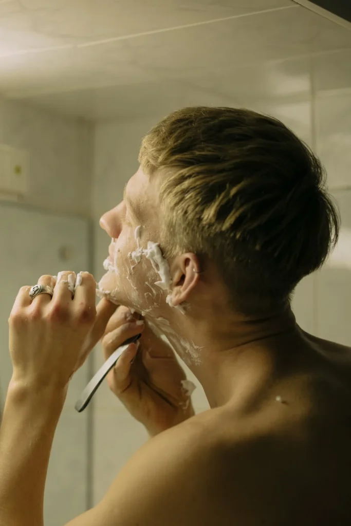 a picture of a man shaving