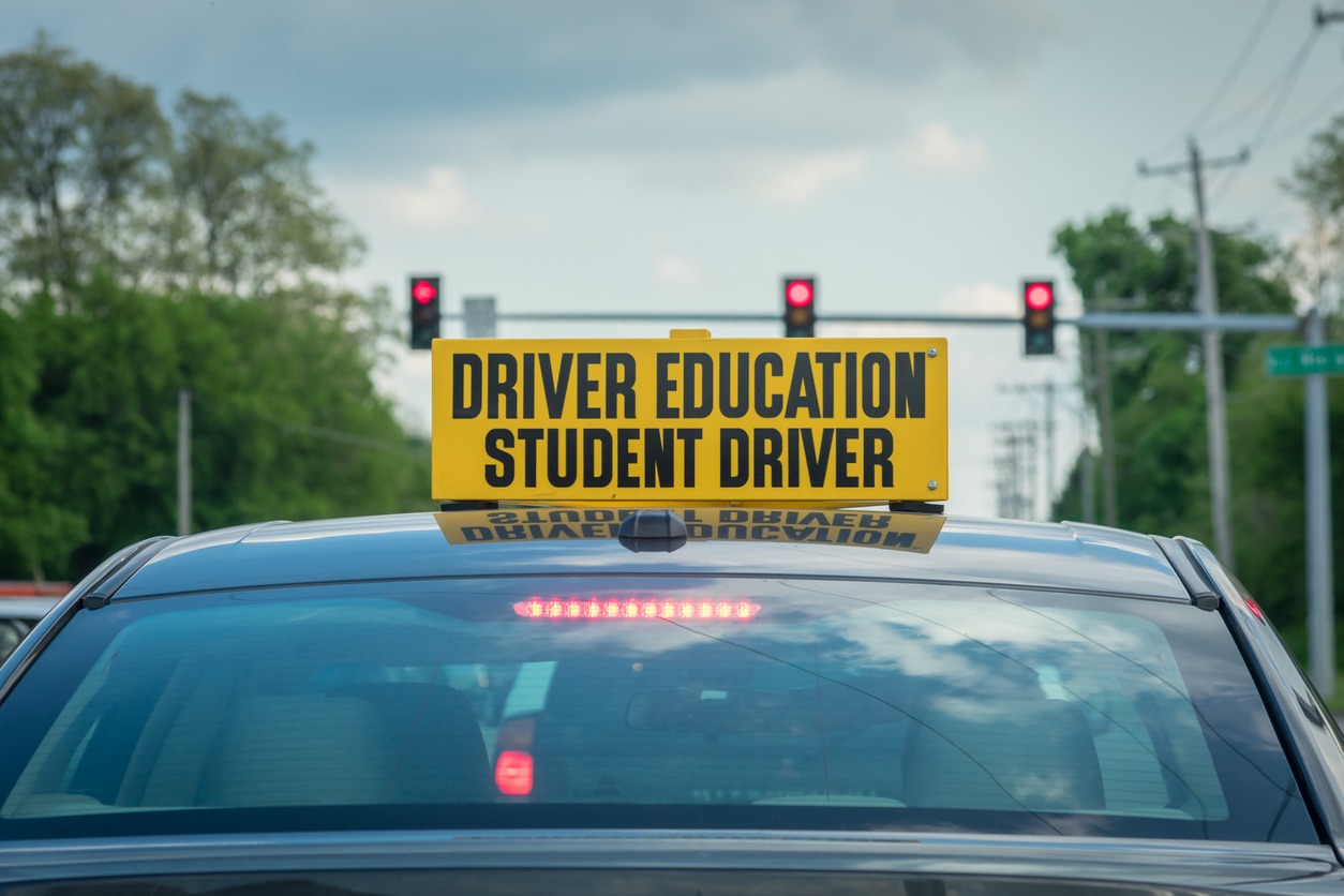  driver ed signage on a car roof