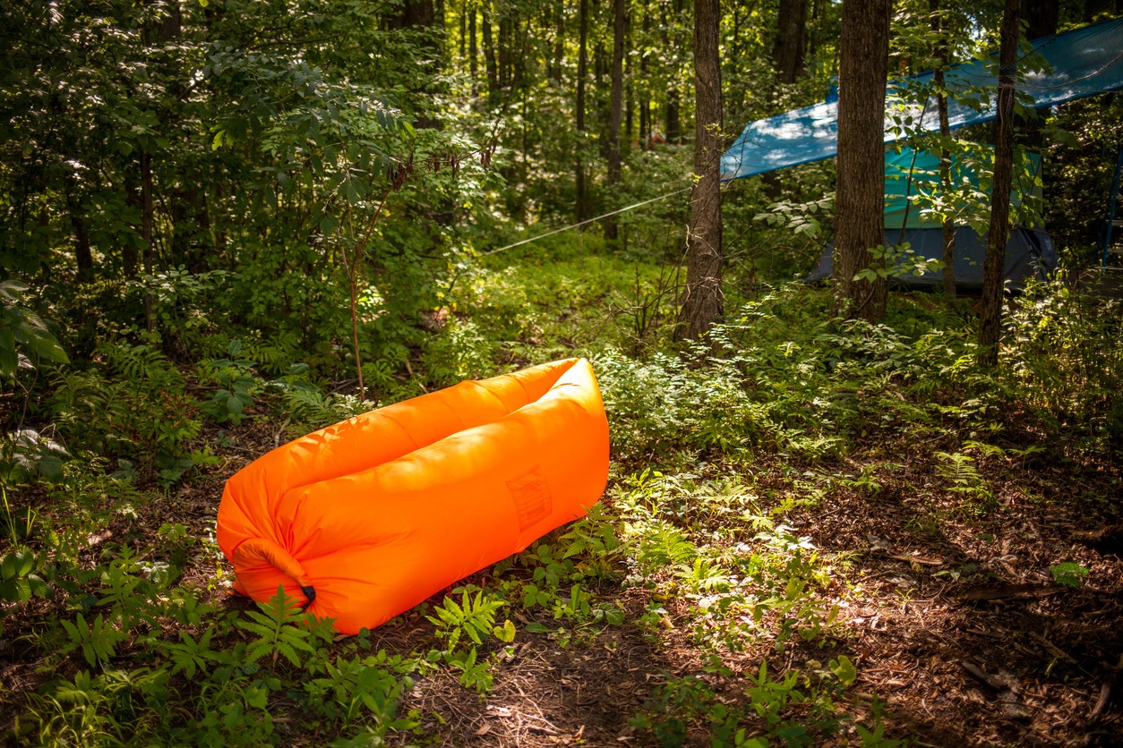inflatable orange sofa in outdoor setting