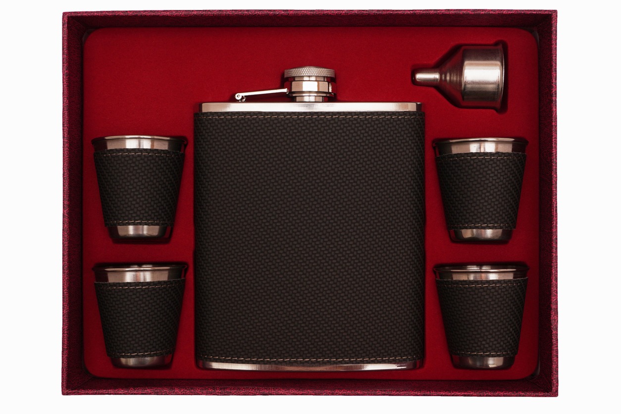 set of hip flask and glasses in a red box