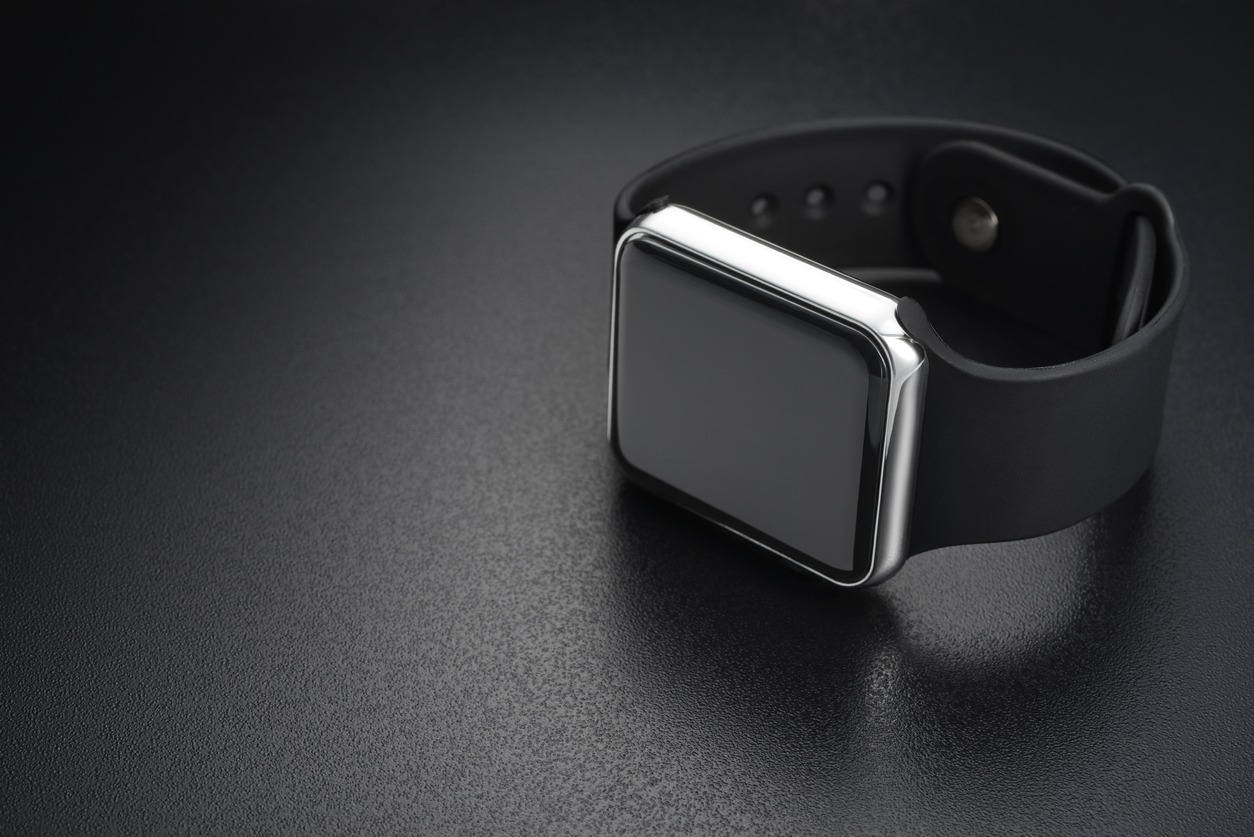 smart wrist watch with black silicon strap in black background