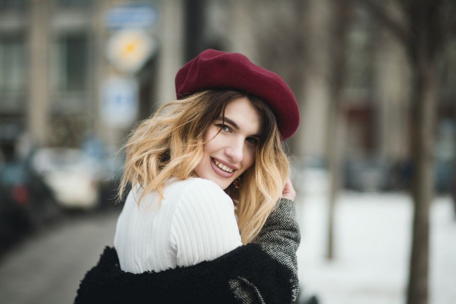 A woman wearing a cute and cozy outfit for the winter