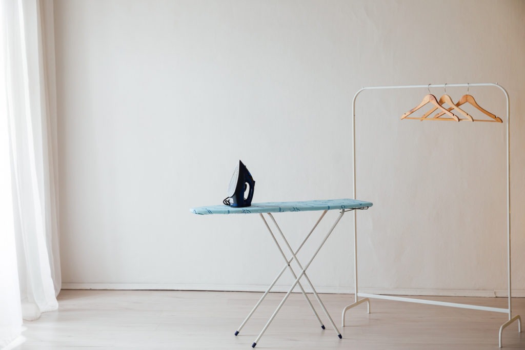 iron and ironing board for ironing things wardrobe