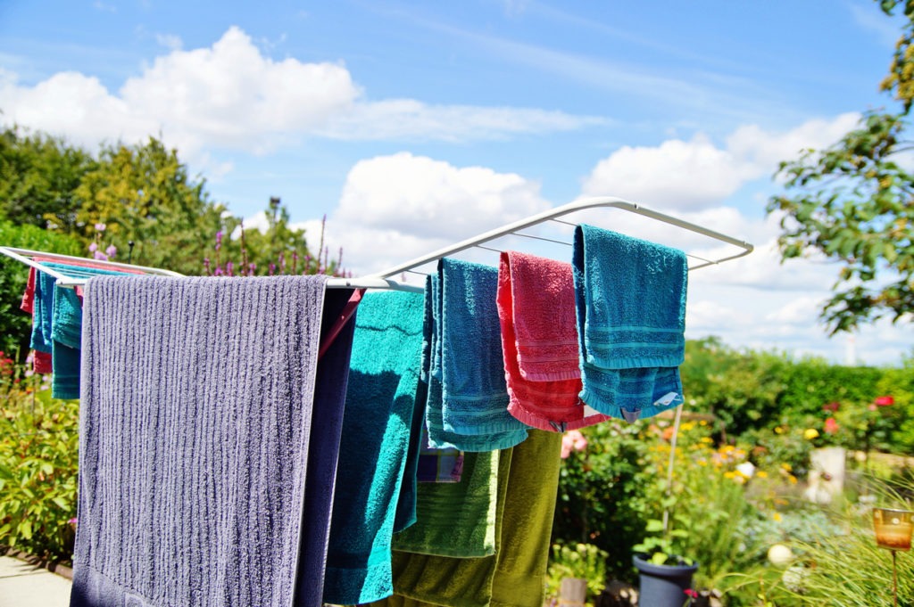Outdoor laundry drying rack standing on the terrace for drying towels
