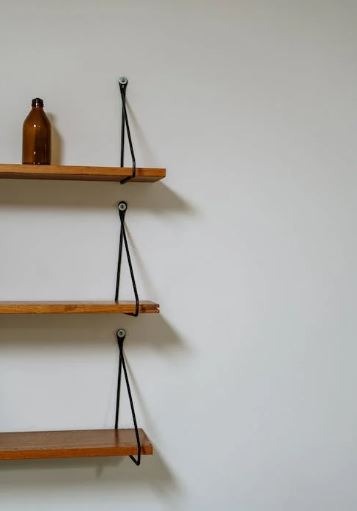 brown wooden wall mounted racks