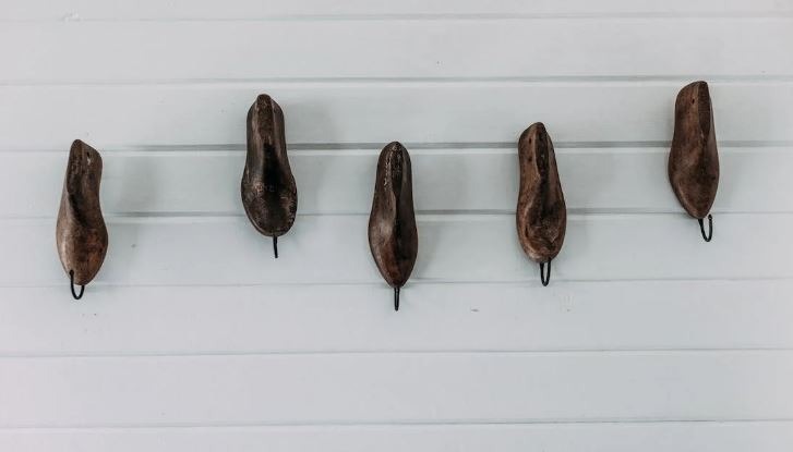 wooden wall hooks on a white wall