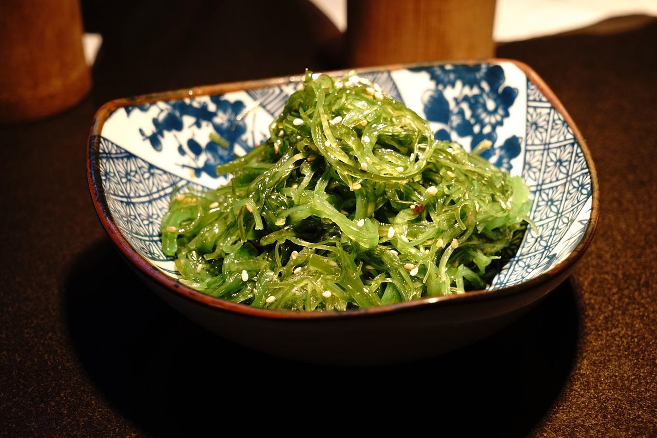 Seaweed salad with avocado slices as toppings