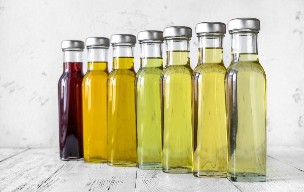 Bottles containing a variety of vegetable oils.