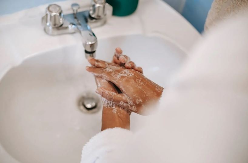 Washing hands near the sink