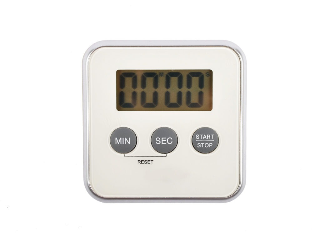 Digital kitchen timer on white background