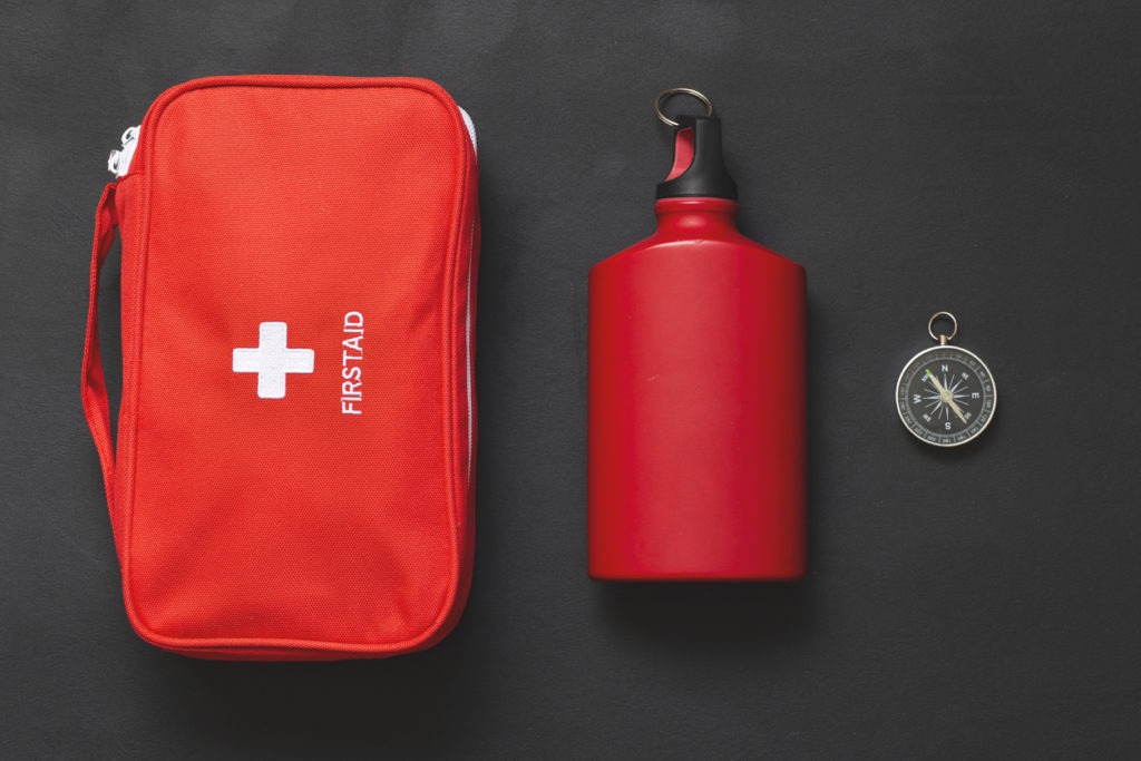 first aid kit and compass