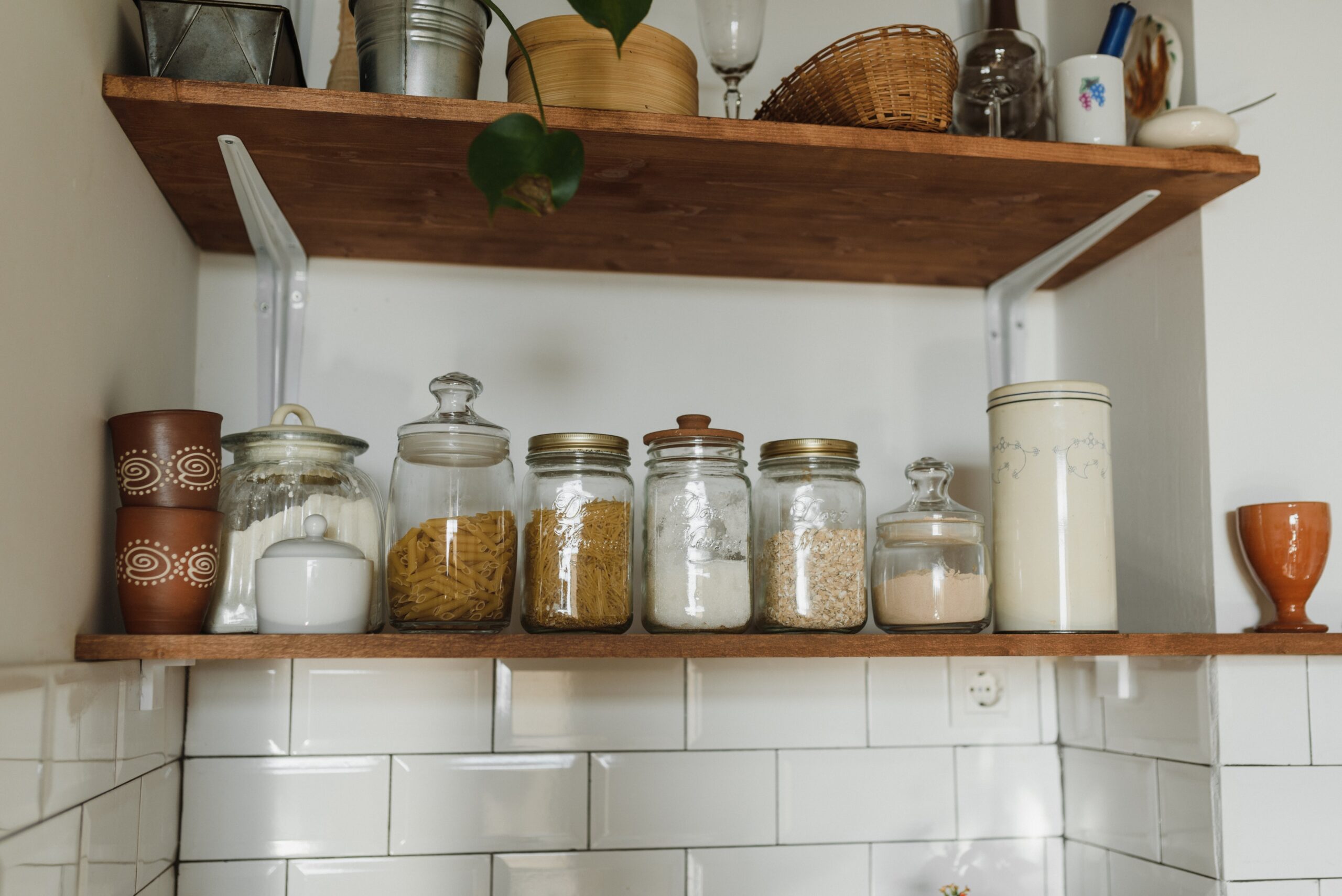 Kitchen racks organized with spice jars and cooking utensils