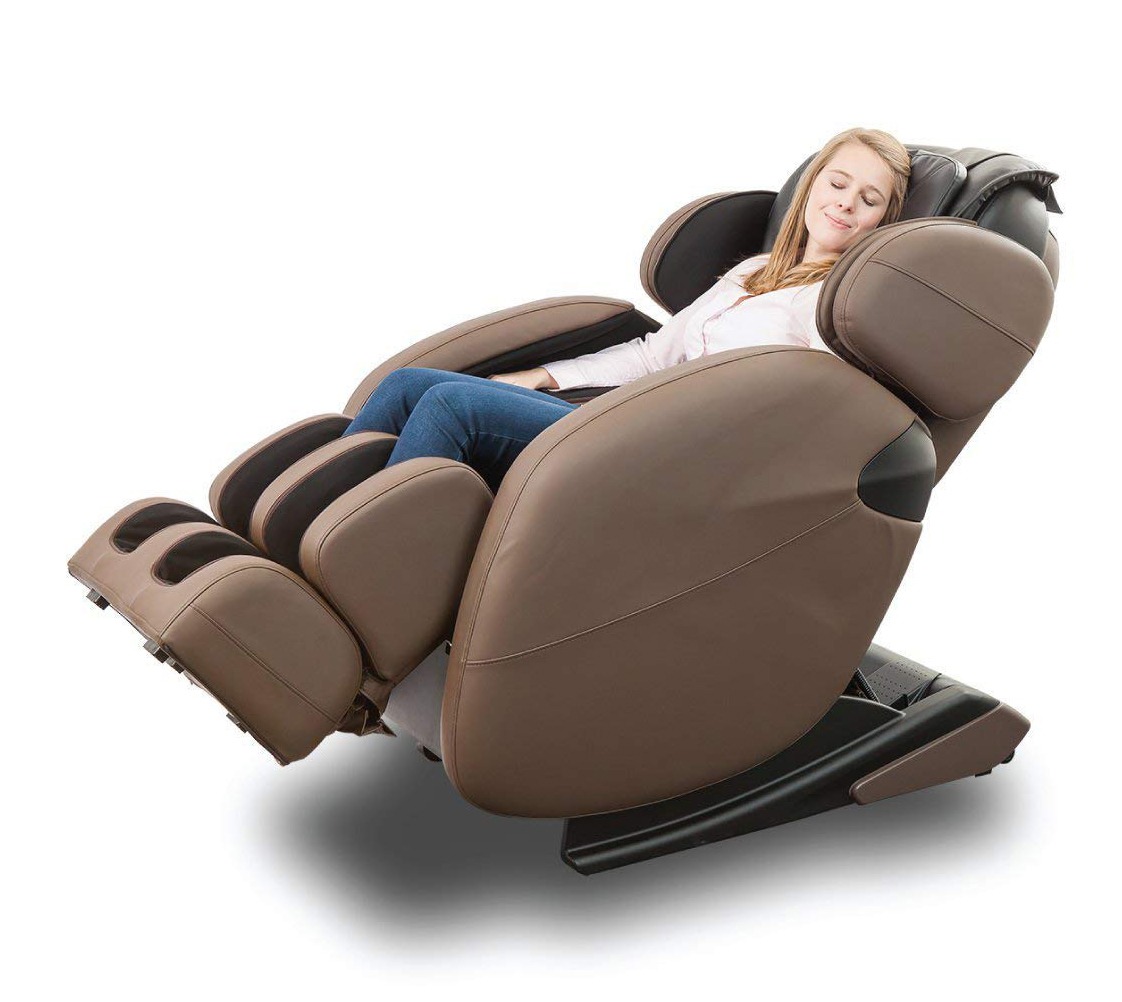 a woman resting on a brown recliner massage chair